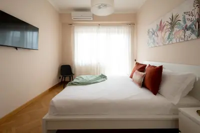 a bedroom with a white bed and a window at Apartment near Vatican & Foro Italico - Rome in Rome