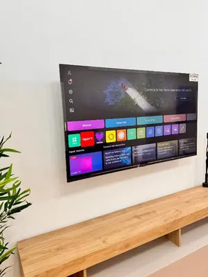 a flat screen tv hanging on a wall at Lolus House in Rome