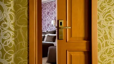 a door leading to a bedroom with a bed at IN Roma Vale&Hillary colosseo b&b in Rome