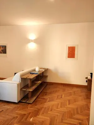 a living room with a couch and a table at Residenza Coronari in Rome