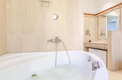 a white bath tub in a bathroom with a sink at Hot Tub - Private Parking - park in Rome