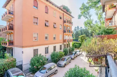 a group of cars parked in front of a building at Hot Tub - Private Parking - park in Rome