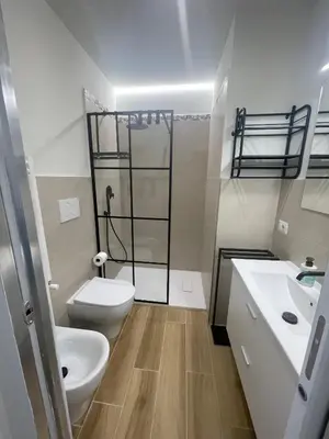a bathroom with a toilet and a shower in it at House - Via Madonna del Riposo - Too in Rome