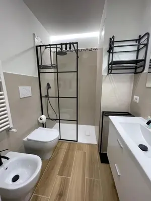 a bathroom with a toilet and a sink and a shower at House - Via Madonna del Riposo - Too in Rome