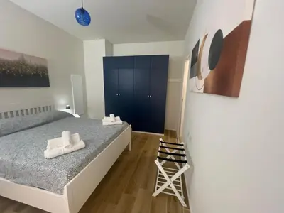 a bedroom with a bed with white towels on it at House - Via Madonna del Riposo - Too in Rome
