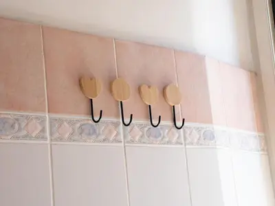 four wooden utensils hanging on a wall at Furio Camillo, Roma Centro in Rome