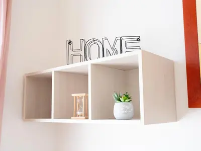 a white shelf with a plant in a white vase at Furio Camillo, Roma Centro in Rome