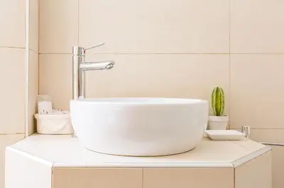 a bathroom with a white sink on a counter at Relais Calamatta in Rome