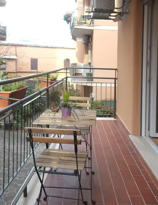 a balcony with two benches and a balcony at Holiday Home Roma in Rome