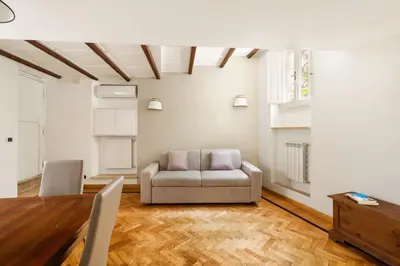 a living room with a couch and a table at Navona Square in Rome