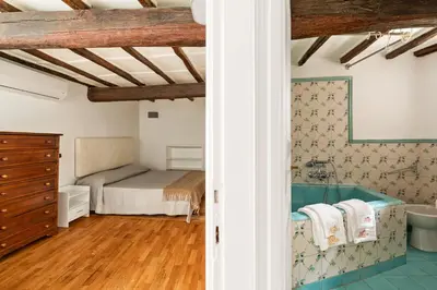 a bedroom with a bed and a bath tub at Navona Square in Rome