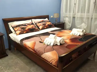a bedroom with a bed with two stuffed animals on it at Dolce Roma House - Parco Appia Antica , Netflix, Prime e Metro sotto casa in Rome