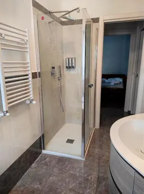 a bathroom with a shower and a sink at Dolce Roma House - Parco Appia Antica , Netflix, Prime e Metro sotto casa in Rome