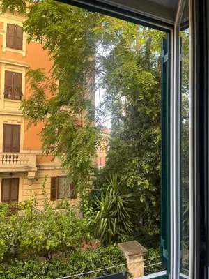 a window with a view of a building at Incontro tra Oriente e Occidente in Rome