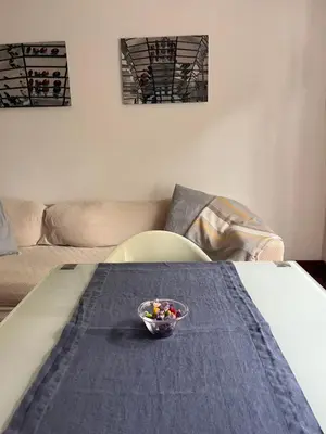 a bowl of candy is sitting on a bed at Incontro tra Oriente e Occidente in Rome