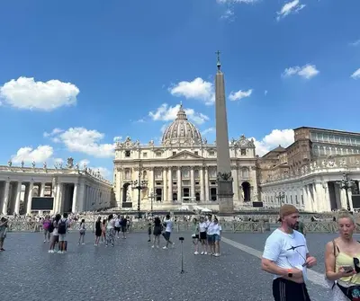 a group of people standing in front of a building at Elegant Studio at Vatican Museum in Rome
