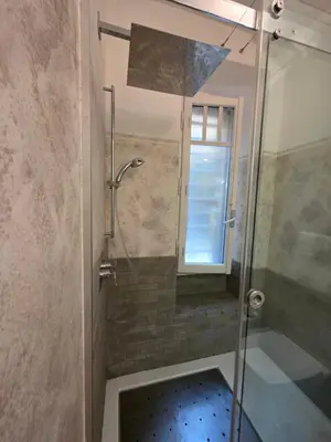 a shower with a glass door in a bathroom at San Pietro Station 2 in Rome