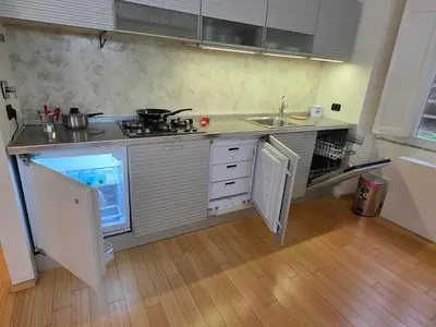 a small kitchen with a stove and a sink at San Pietro Station 2 in Rome
