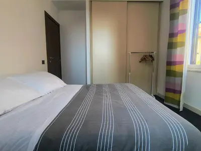 a bedroom with a large bed in a room at Domus Oleandri - WelcomeToRhome in Rome