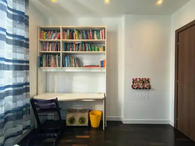 a room with a desk and a book shelf with books at Domus Oleandri - WelcomeToRhome in Rome