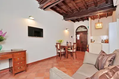a living room with a couch and a table at Cancelleriadieci in Rome