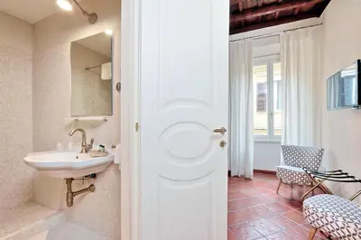 a bathroom with a sink and a mirror at Cancelleriadieci in Rome