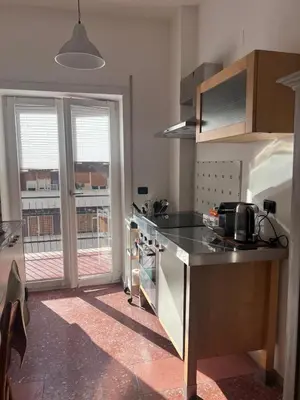 a kitchen with a sink and a stove top oven at Appartamento Eataly in Rome