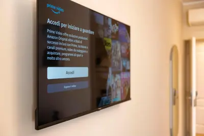 a flat screen tv hanging on a wall at Lussuosa casa zona esquilino in Rome
