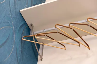 a pair of metal chairs against a wall at Lussuosa casa zona esquilino in Rome