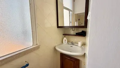 a bathroom with a sink and a mirror at Il Segreto del Borgo Vaticano in Rome