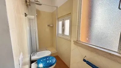 a bathroom with a toilet and a sink and a window at Il Segreto del Borgo Vaticano in Rome