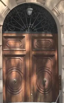 a wooden door with a design on it at Dimora delle Vittorie - Vaticano in Rome