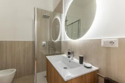 a bathroom with a sink and a mirror at Dimora delle Vittorie - Vaticano in Rome