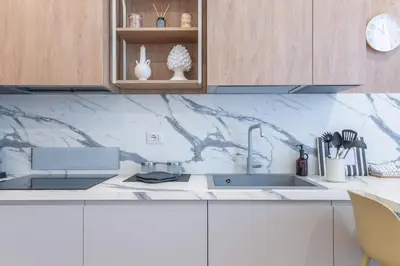 a kitchen with a sink and a counter top at Dimora delle Vittorie - Vaticano in Rome