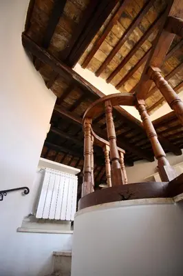 a room with a wooden ceiling and a window at Calisto 6 in Rome