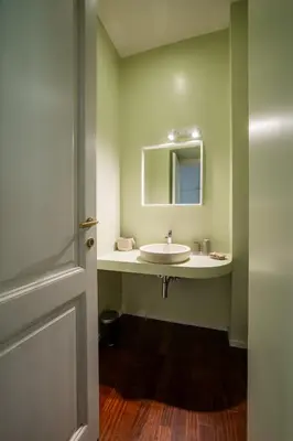 a bathroom with a sink and a mirror at Casa Lavinia - Basilica Santa Maria Maggiore in Rome