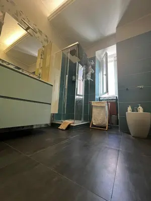 a bathroom with a shower and a sink and a mirror at Rome full apt 4 people close to Colosseum Mao house in Rome
