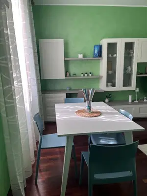 a dining room with a white table and chairs at Rome full apt 4 people close to Colosseum Mao house in Rome