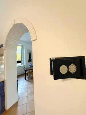 a room with a wall with a clock on the wall at Domus Mantellate, Trastevere in Rome