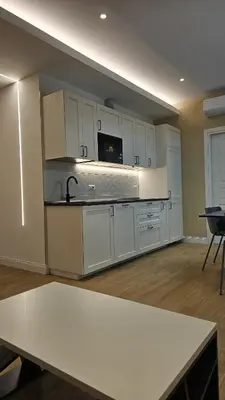 a kitchen with white cabinets and a white counter top at La Belle Étoile in Rome
