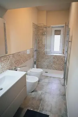 a bathroom with two sinks and a tub and a shower at Room in Rome in Rome