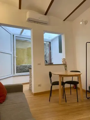 a living room with a table and a couch at Navona Sweet Home in Rome