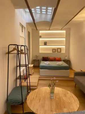 a living room with a bed and a table at Navona Sweet Home in Rome