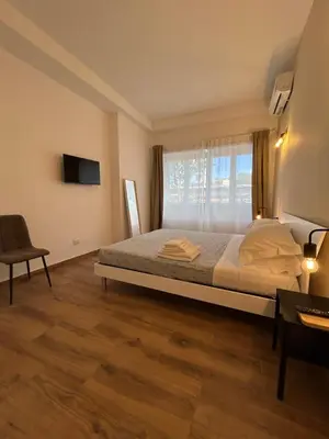 a bedroom with a large bed and a window at Interno 2 alle Mura in Rome
