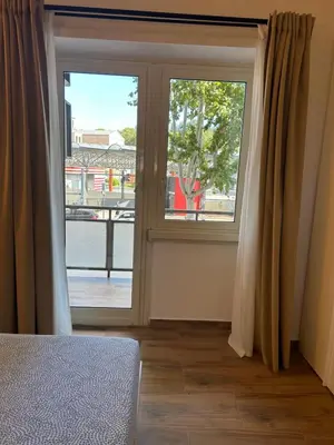 a room with a window with a view of a street at Interno 2 alle Mura in Rome