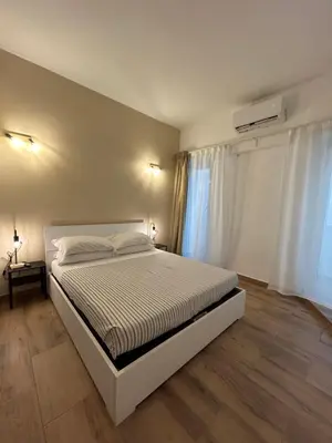 a bedroom with a white bed and a window at Interno 2 alle Mura in Rome