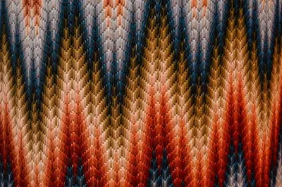 a close up of a multicolored blanket at Piazza Vittorio Urban Stay in Rome
