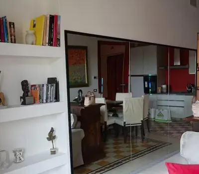 a kitchen and dining room with a table and a dining room at Piazza Vittorio Urban Stay in Rome