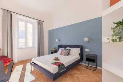 a bedroom with a bed and a window at iFlat The Sweet Life in Rome in Rome