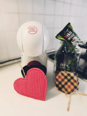 a chef with a red heart on a kitchen counter at Elegant apartment 5 minutes from the subway in Rome